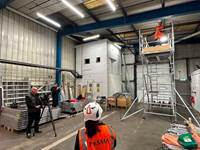 A group of people in a warehouse
AI-generated content may be incorrect.